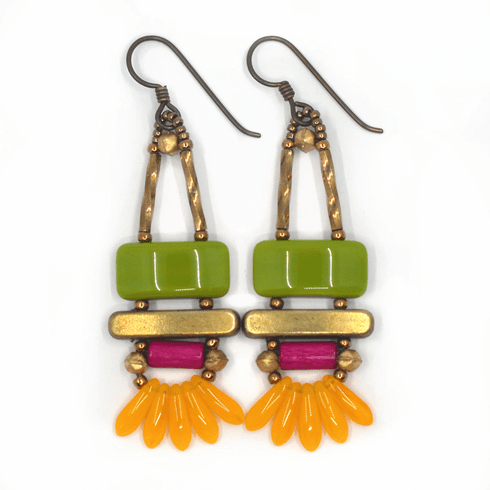 Bright green, magenta and light orange earrings on white background. These earrings have dark ear wires and gold accents. There is an avocado green rectangle on top and a gold bar beneath it. Belowthe bar is a magenta tube with gold beads on either side. At the bottom is a fan of five semi-transparent light orange dagger beads.