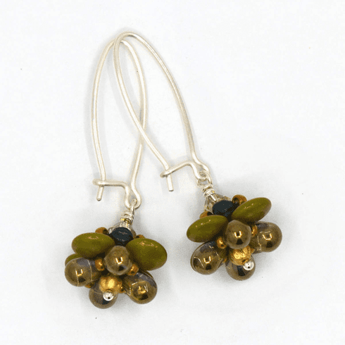 A pair of silver and translucent teal earrings on a white background. The earrings have long silver oval wires that latch and the dangling parts are beaded flowers that have avocado green petals and bronze accents.