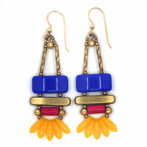 Blue, orange and magenta earrings with gold accents and ear wires. These earrings have blue rectangles stacked on top of gold bars. Below the bars is a magenta tube, and at the bottom is a fan of five semi-transparent light orange mini daggers. 